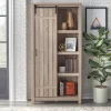 71" Glasbern Tall Farmhouse Barn Door Bookcase Weathered Gray - Buylateral 2 71" Glasbern Tall Farmhouse Barn Door Bookcase Weathered Gray - Buylateral -Living Room Furniture Store GUEST 28d06e89 dfbb 4b65 a164 2bda9a9da3b9